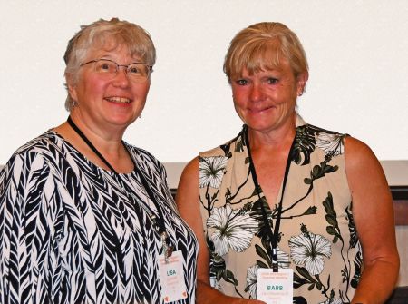 Barb Laschkewitsch receiving 2025 VEEP award from Region 1 President, Lisa Schmidt, at the Region 1 Summer meeting.